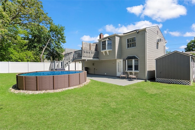 105 Fountain Ave, Selden, NY 11784 - back of house with a chimney, stairs, and a patio