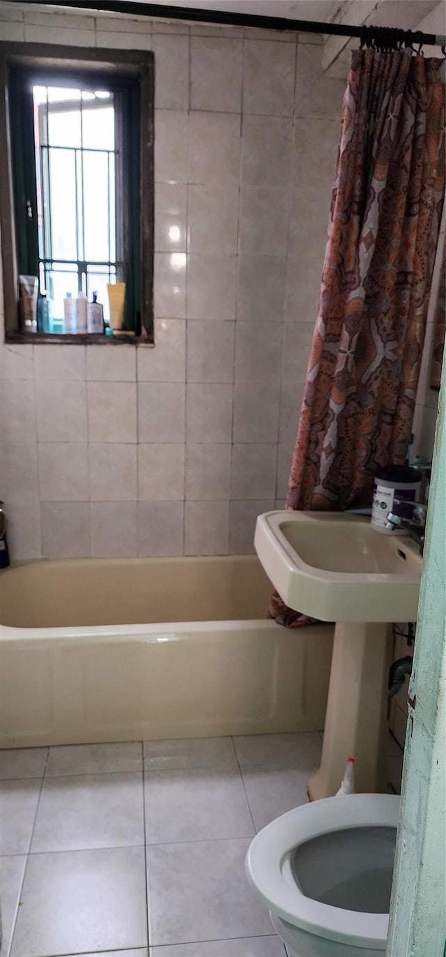 7 Metropolitan Oval Unit 5G, Bronx, NY 10462 - bathroom featuring tile patterned floors, toilet, and shower / tub combo with curtain