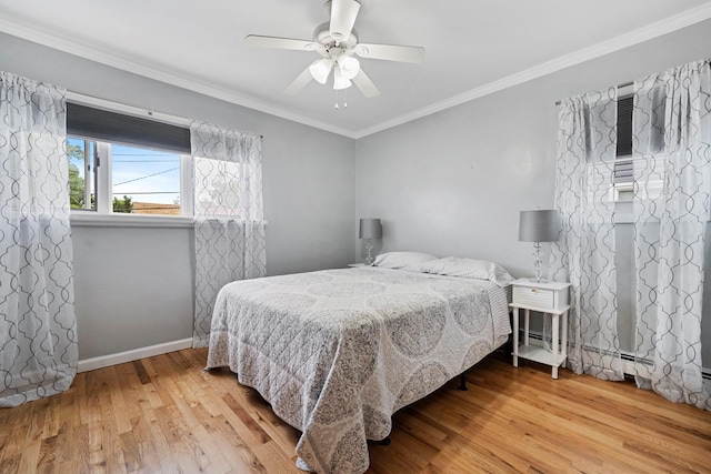 9 Duke St, North Babylon, NY 11703 - bedroom with wood finished floors, crown molding, baseboards, and ceiling fan