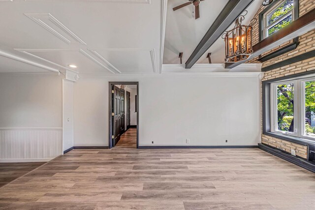 1 William St, Glen Cove, NY 11542 - spare room with healthy amount of natural light, crown molding, wood finished floors, a ceiling fan, and baseboards