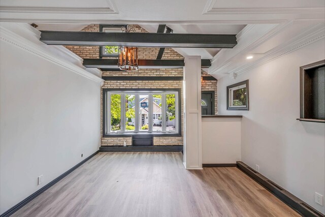 1 William St, Glen Cove, NY 11542 - unfurnished dining area with wood finished floors, a chandelier, baseboards, and ornamental molding