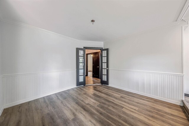 1 William St, Glen Cove, NY 11542 - empty room with wood finished floors, ornamental molding, and wainscoting