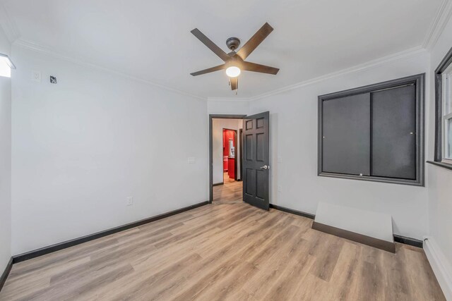 1 William St, Glen Cove, NY 11542 - unfurnished room featuring light wood-style floors, a ceiling fan, crown molding, and baseboards