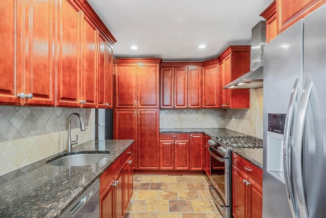 1 William St, Glen Cove, NY 11542 - kitchen featuring appliances with stainless steel finishes, wall chimney range hood, a sink, dark brown cabinets, and dark stone counters