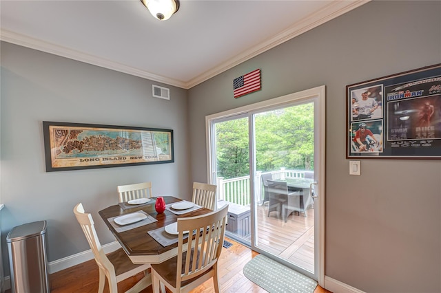86 Manitou Trl, Kings Park, NY 11754 - dining space with ornamental molding, wood finished floors, and baseboards
