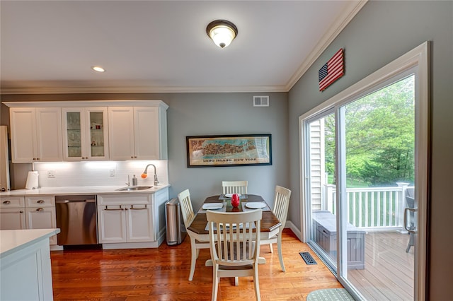 86 Manitou Trl, Kings Park, NY 11754 - dining area with ornamental molding and light wood-style flooring