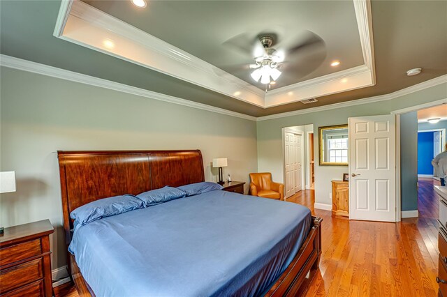 86 Manitou Trl, Kings Park, NY 11754 - bedroom with a raised ceiling, wood finished floors, crown molding, baseboards, and a ceiling fan