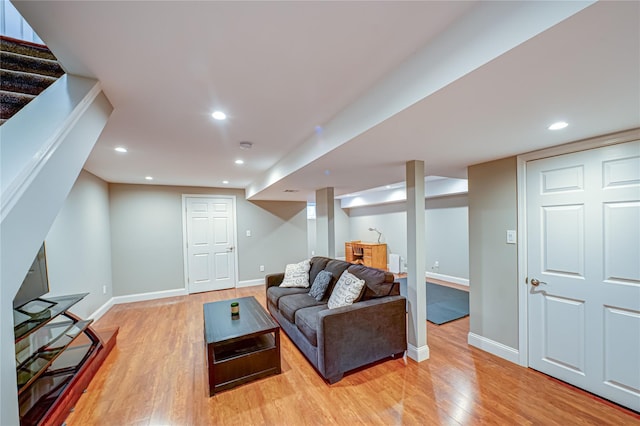 86 Manitou Trl, Kings Park, NY 11754 - living area with light wood finished floors, baseboards, stairs, and recessed lighting
