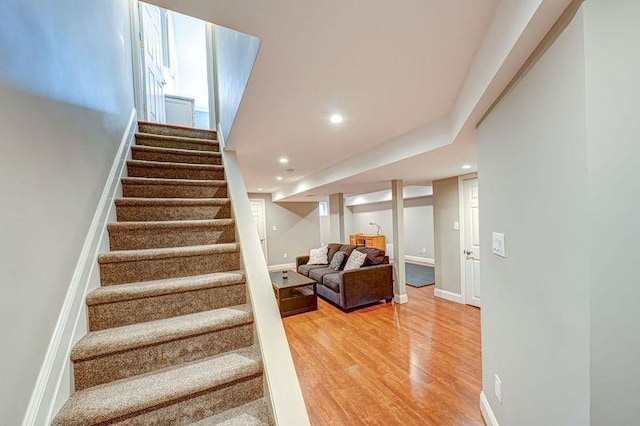 86 Manitou Trl, Kings Park, NY 11754 - stairs featuring wood finished floors, recessed lighting, and baseboards