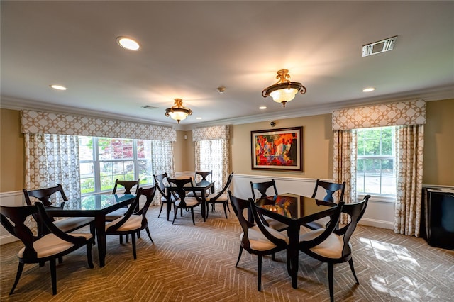 86 Manitou Trl, Kings Park, NY 11754 - dining space featuring crown molding, plenty of natural light, baseboards, and recessed lighting