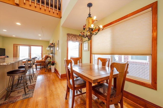 991 W Park Ave, Long Beach, NY 11561 - dining area featuring a chandelier, wood finished floors, baseboards, and recessed lighting