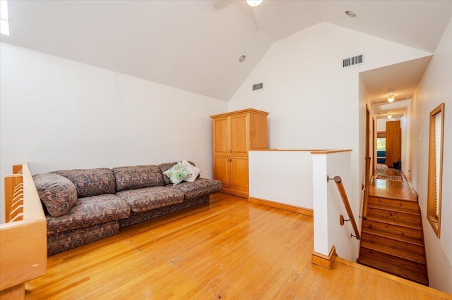 991 W Park Ave, Long Beach, NY 11561 - living room with high vaulted ceiling, light wood-type flooring, and ceiling fan