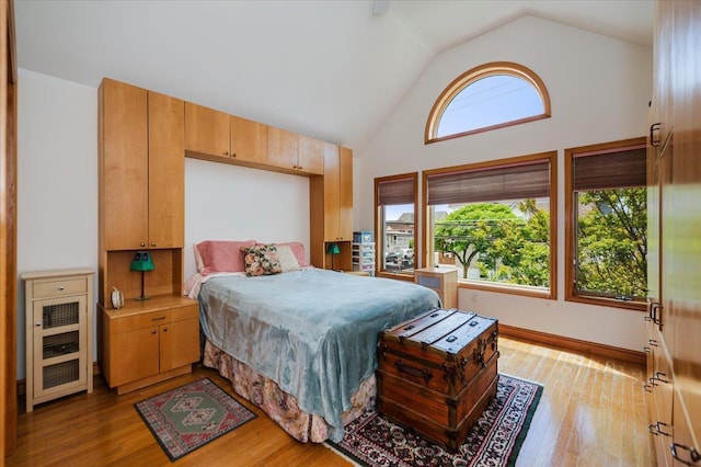 991 W Park Ave, Long Beach, NY 11561 - bedroom featuring wood finished floors and high vaulted ceiling