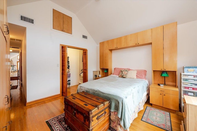 991 W Park Ave, Long Beach, NY 11561 - bedroom with high vaulted ceiling, light wood-style flooring, and a closet
