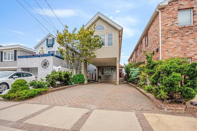 991 W Park Ave, Long Beach, NY 11561 - view of front of property featuring a carport, driveway, and brick siding