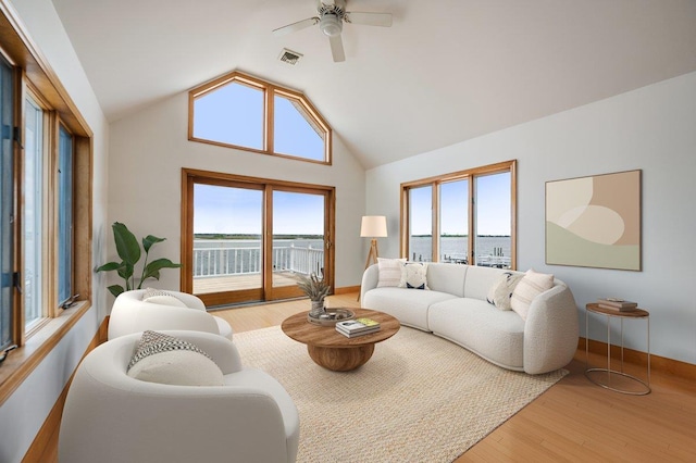 991 W Park Ave, Long Beach, NY 11561 - living room with wood finished floors, vaulted ceiling, ceiling fan, and a water view