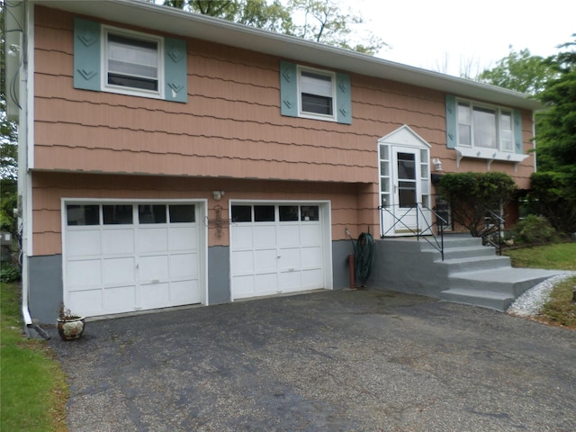 17 Johanna Ln, Monsey, NY 10952 - view of front facade featuring a garage and asphalt driveway