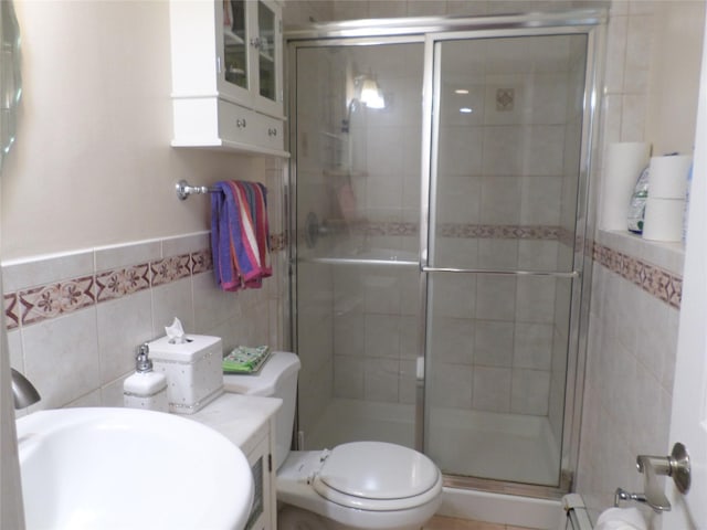 17 Johanna Ln, Monsey, NY 10952 - full bath with tile walls, a stall shower, toilet, and a sink