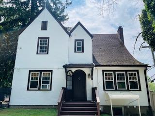1 Spencer Ct, Hartsdale, NY 10530 - view of front of property featuring a chimney and a front lawn