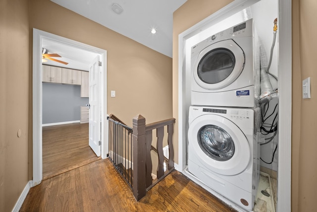 40-40 203rd St Unit 12B, Bayside, NY 11361 - laundry area with stacked washing machine and dryer, dark wood finished floors, baseboards, and recessed lighting