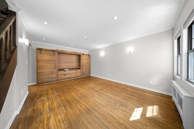 40-40 203rd St Unit 12B, Bayside, NY 11361 - unfurnished living room featuring ornamental molding, wood finished floors, baseboards, and recessed lighting