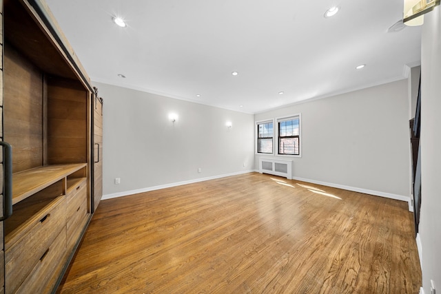 40-40 203rd St Unit 12B, Bayside, NY 11361 - spare room with ornamental molding, baseboards, wood finished floors, and recessed lighting