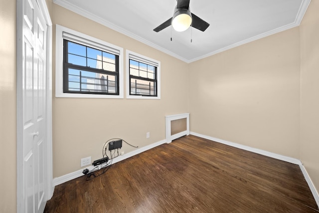 40-40 203rd St Unit 12B, Bayside, NY 11361 - spare room featuring wood finished floors, baseboards, crown molding, and a ceiling fan