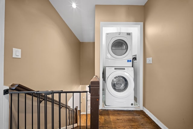 40-40 203rd St Unit 12B, Bayside, NY 11361 - laundry room featuring estacked washer and dryer, wood finished floors, and baseboards