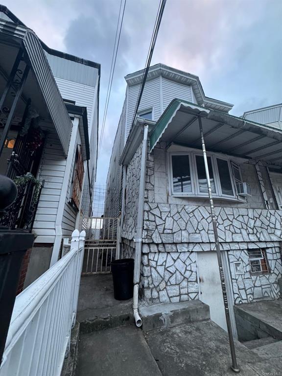 102-10 32nd Ave, East Elmhurst, NY 11369 - view of property exterior with stone siding