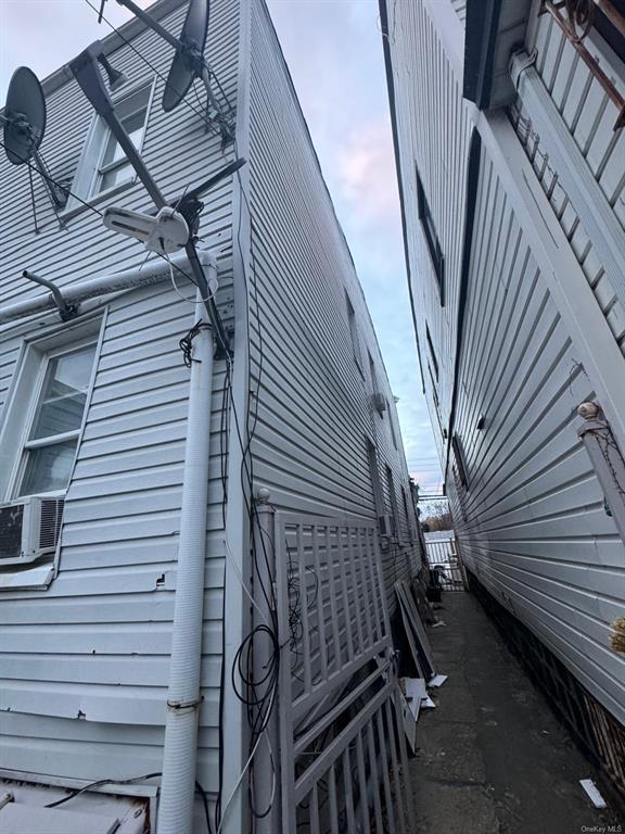 102-10 32nd Ave, East Elmhurst, NY 11369 - view of side of property with cooling unit