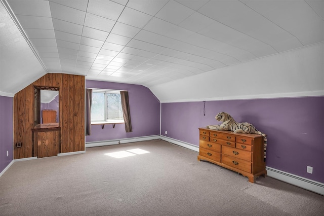 336 Auborn Ave, Shirley, NY 11967 - bonus room featuring a baseboard radiator, vaulted ceiling, carpet, and baseboards