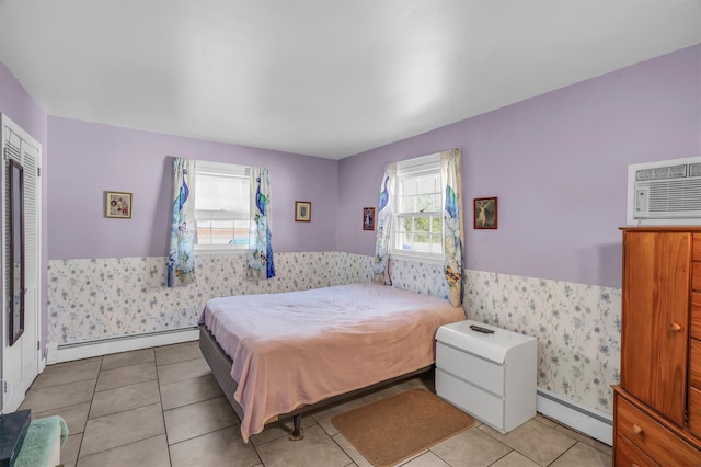 336 Auborn Ave, Shirley, NY 11967 - bedroom featuring a baseboard radiator, wainscoting, a baseboard heating unit, a wall mounted air conditioner, and wallpapered walls