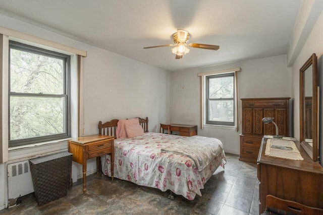 32-25 91st St Unit 209, East Elmhurst, NY 11369 - bedroom featuring radiator heating unit and ceiling fan