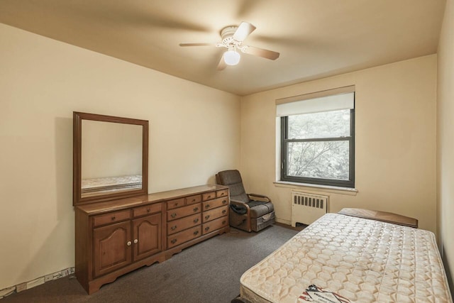 32-25 91st St Unit 209, East Elmhurst, NY 11369 - carpeted bedroom featuring radiator heating unit and ceiling fan