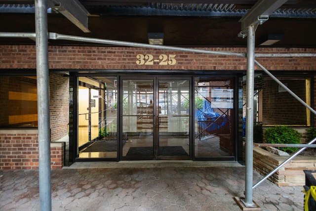 32-25 91st St Unit 209, East Elmhurst, NY 11369 - property entrance featuring brick siding