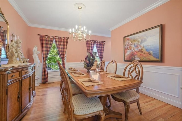 646 Rte 311, Patterson, NY 12563 - dining area with a chandelier, light wood-style flooring, ornamental molding, and wainscoting