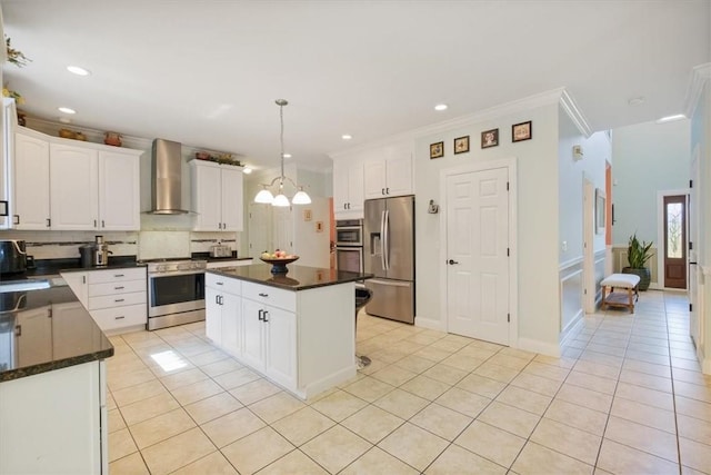646 Rte 311, Patterson, NY 12563 - kitchen with stainless steel appliances, wall chimney range hood, light tile patterned floors, tasteful backsplash, and ornamental molding
