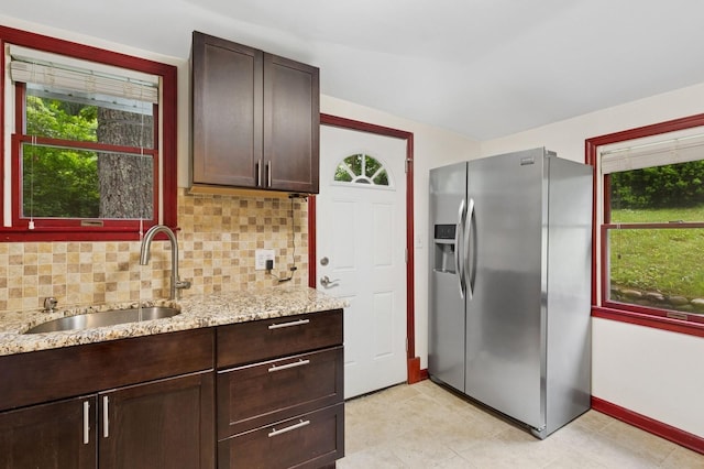 5 Murray Hill Rd, Sound Beach, NY 11789 - kitchen featuring stainless steel fridge, a sink, healthy amount of natural light, tasteful backsplash, and vaulted ceiling