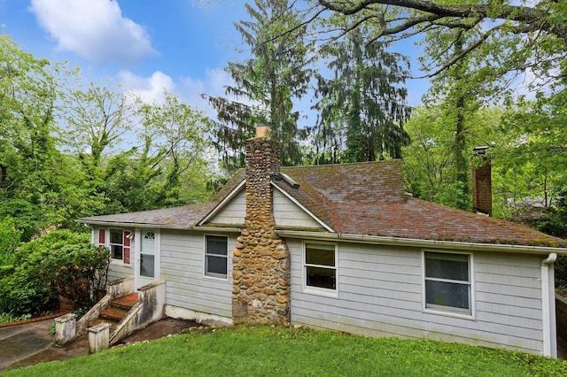 5 Murray Hill Rd, Sound Beach, NY 11789 - back of property with a chimney and a yard