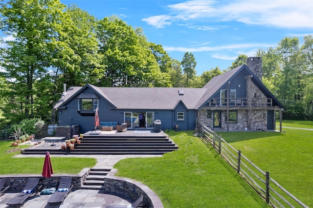 281 Hubert Rd, Jeffersonville, NY 12748 - rear view of house with an outdoor living space, stone siding, a chimney, and roof with shingles
