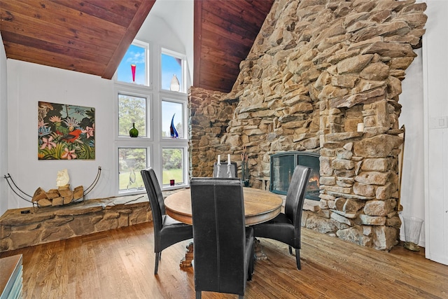 281 Hubert Rd, Jeffersonville, NY 12748 - dining area with high vaulted ceiling, wood finished floors, healthy amount of natural light, wooden ceiling, and a fireplace