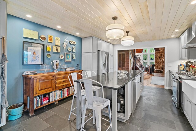 281 Hubert Rd, Jeffersonville, NY 12748 - kitchen featuring stainless steel appliances, wood ceiling, a kitchen island, recessed lighting, and a kitchen breakfast bar