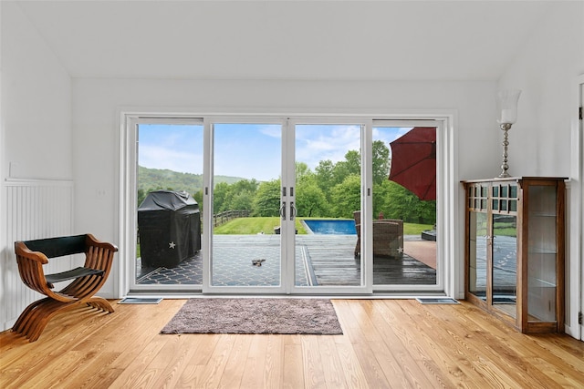 281 Hubert Rd, Jeffersonville, NY 12748 - entryway with french doors, wood-type flooring, plenty of natural light, wainscoting, and lofted ceiling