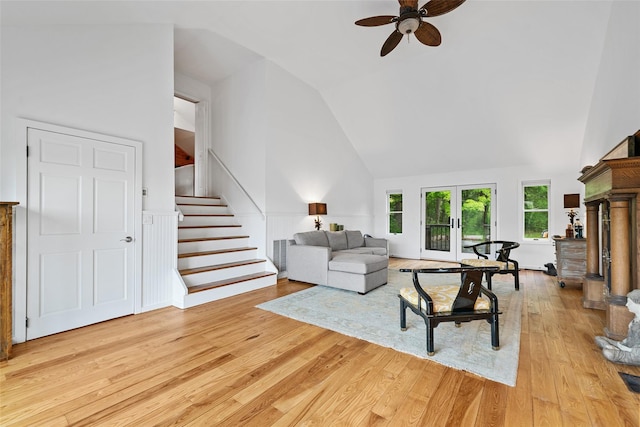 281 Hubert Rd, Jeffersonville, NY 12748 - living room with a ceiling fan, high vaulted ceiling, light wood finished floors, stairway, and french doors