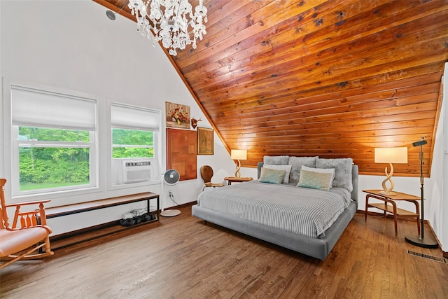 281 Hubert Rd, Jeffersonville, NY 12748 - bedroom featuring vaulted ceiling, a chandelier, cooling unit, wood finished floors, and baseboards