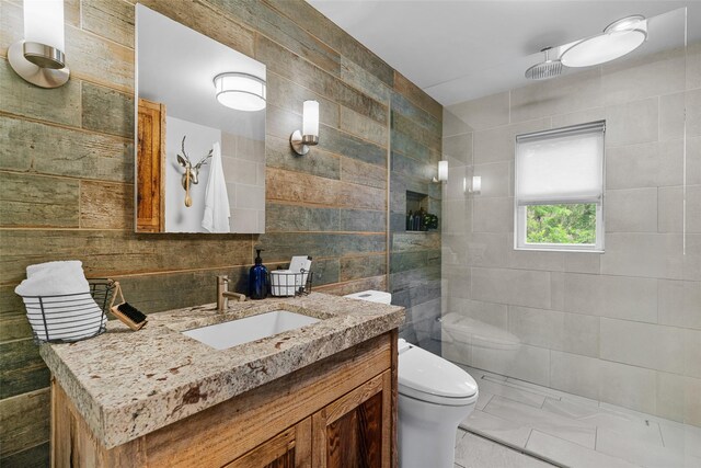281 Hubert Rd, Jeffersonville, NY 12748 - bathroom with tile walls, vanity, toilet, walk in shower, and decorative backsplash