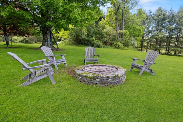 281 Hubert Rd, Jeffersonville, NY 12748 - view of grassy yard with a fire pit and view of wooded area