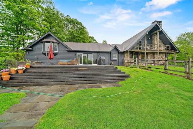 281 Hubert Rd, Jeffersonville, NY 12748 - back of property with stone siding, roof with shingles, and a chimney
