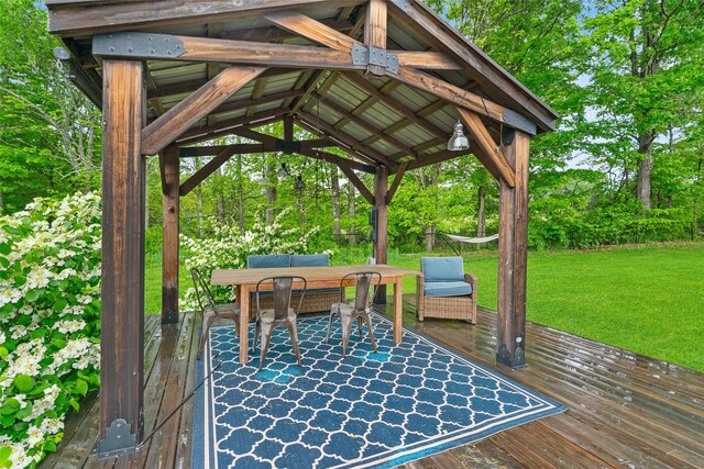281 Hubert Rd, Jeffersonville, NY 12748 - wooden deck with a gazebo, a lawn, outdoor dining area, and view of wooded area