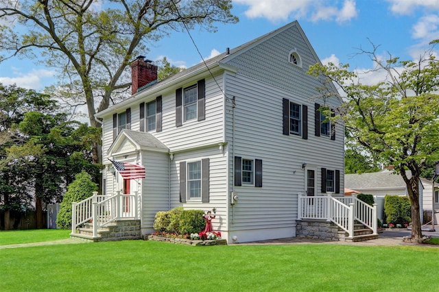 170 Little E Neck Rd S, Babylon, NY 11702 - view of front of property featuring a chimney and a front lawn